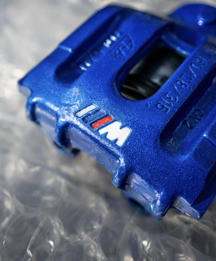 BMW M brake caliper in blue with stripe detail