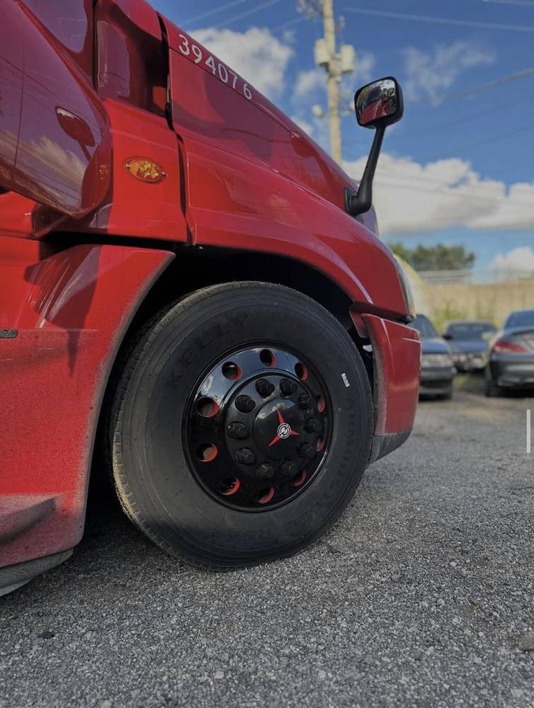 Semi truck with gloss black wheels and red accents